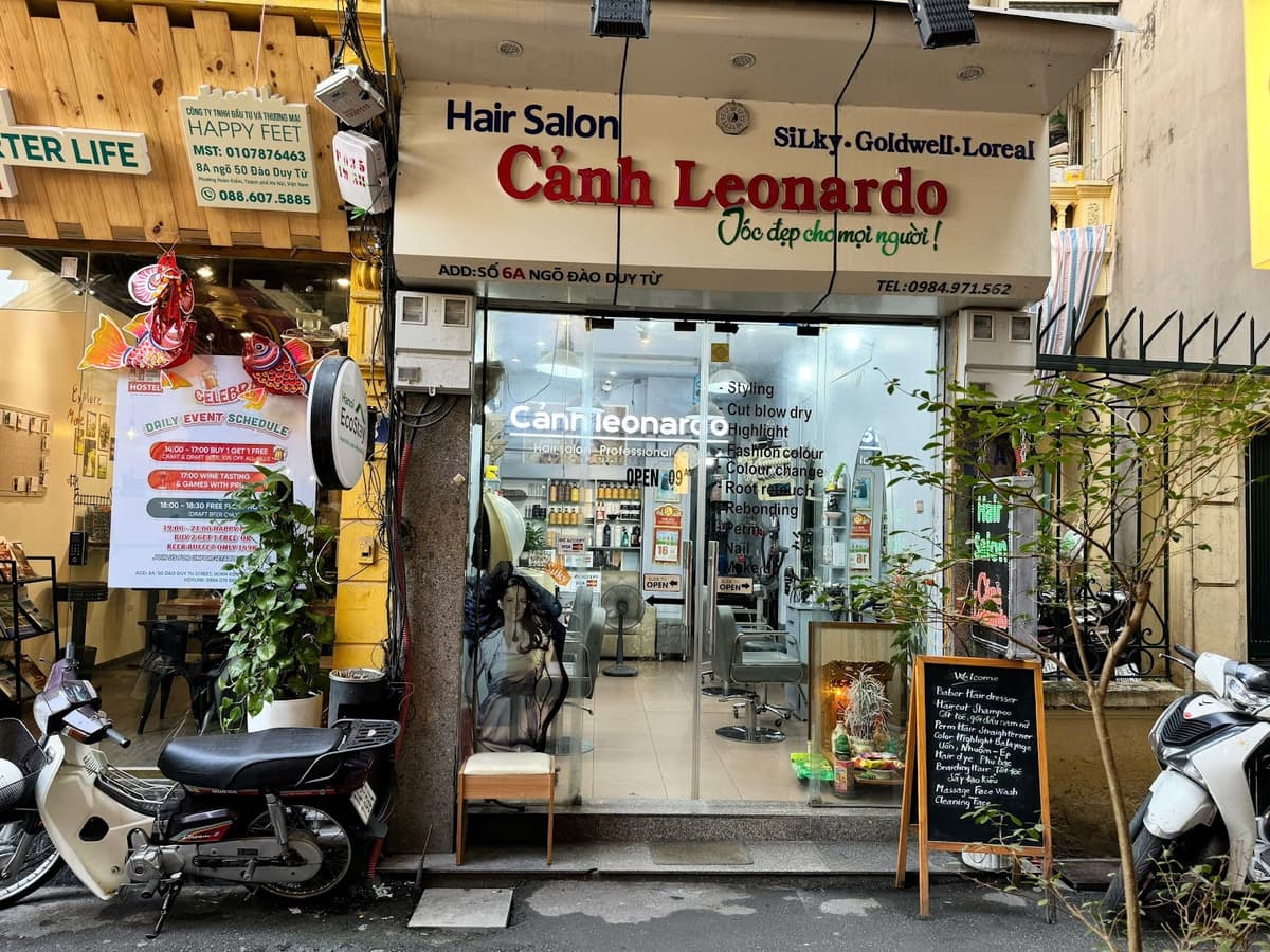 Professional barber styling hair in modern shop